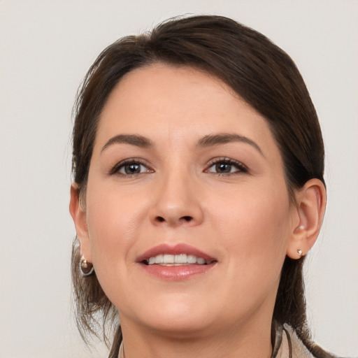 Joyful white young-adult female with medium  brown hair and brown eyes