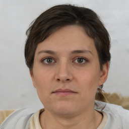 Neutral white young-adult female with short  brown hair and brown eyes