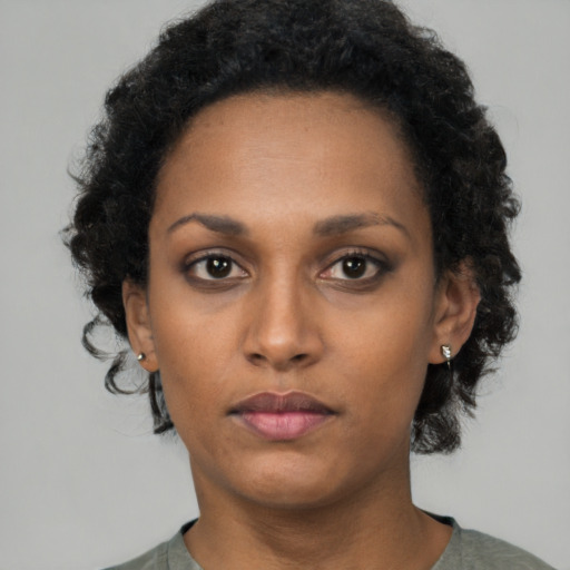 Neutral black young-adult female with short  black hair and brown eyes