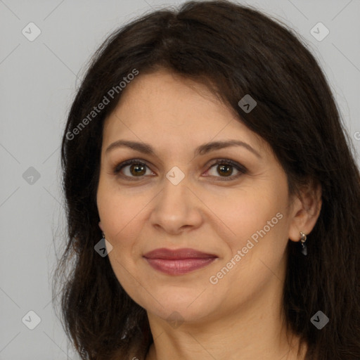 Joyful white adult female with long  brown hair and brown eyes