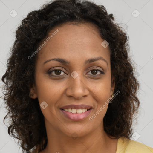 Joyful black young-adult female with medium  brown hair and brown eyes