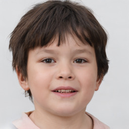 Joyful white child female with short  brown hair and brown eyes