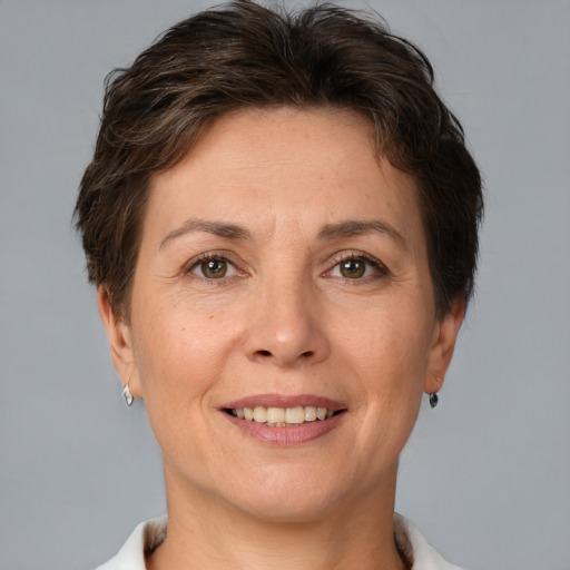 Joyful white adult female with short  brown hair and brown eyes