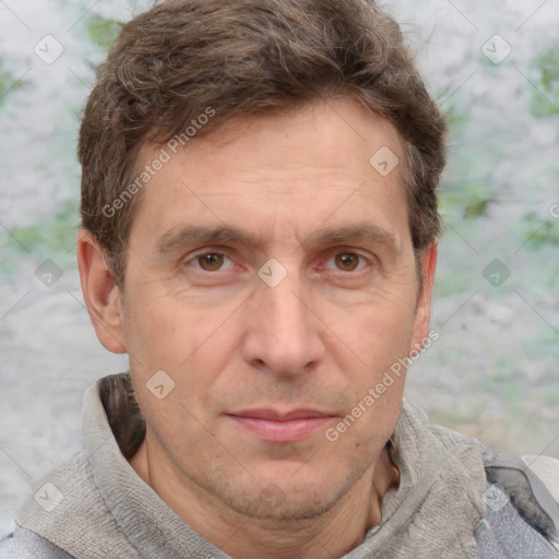 Joyful white adult male with short  brown hair and grey eyes