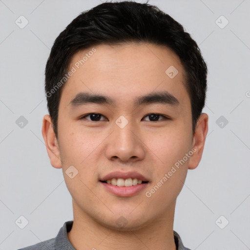 Joyful asian young-adult male with short  black hair and brown eyes