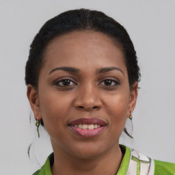 Joyful black young-adult female with short  brown hair and brown eyes