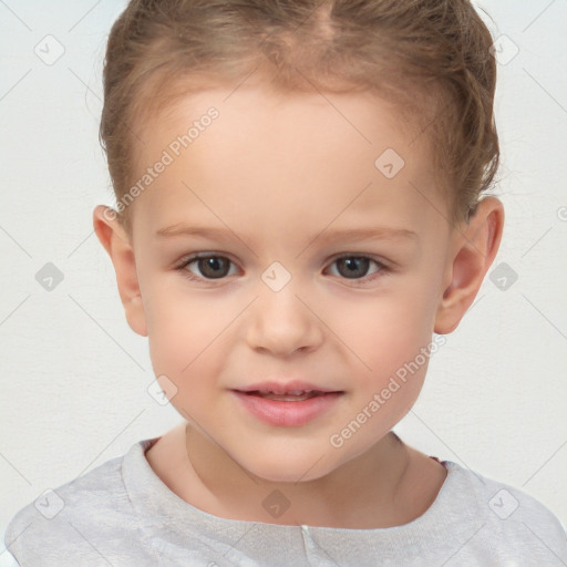 Joyful white child female with short  brown hair and brown eyes