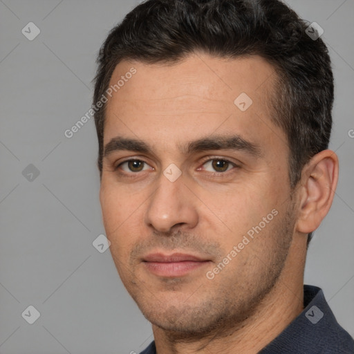 Joyful white young-adult male with short  brown hair and brown eyes