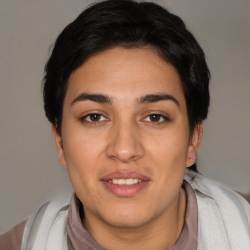 Joyful white young-adult female with short  black hair and brown eyes