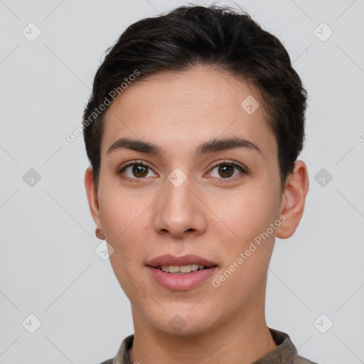 Joyful white young-adult female with short  brown hair and brown eyes