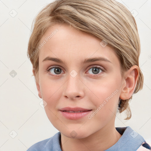 Joyful white young-adult female with medium  brown hair and blue eyes