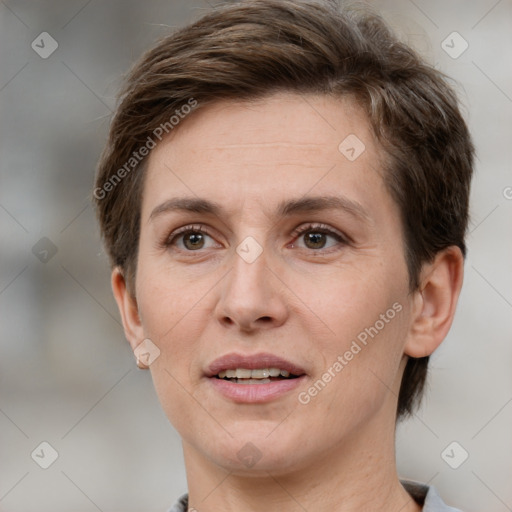 Joyful white adult female with short  brown hair and grey eyes