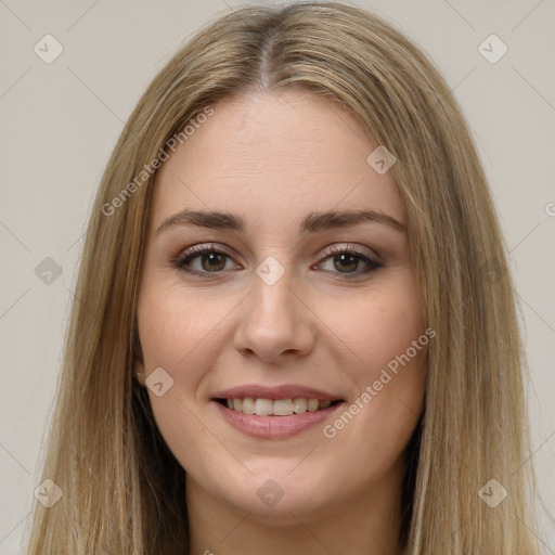 Joyful white young-adult female with long  brown hair and green eyes