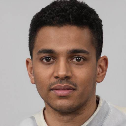 Neutral black young-adult male with short  black hair and brown eyes