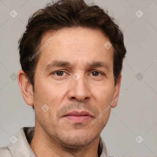 Joyful white adult male with short  brown hair and grey eyes