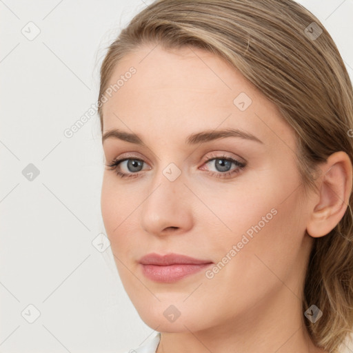 Joyful white young-adult female with long  brown hair and blue eyes