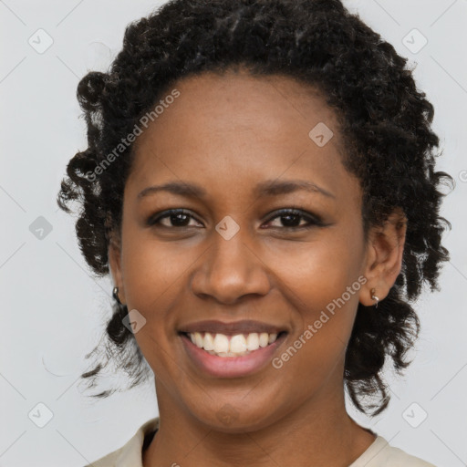 Joyful black young-adult female with medium  black hair and brown eyes