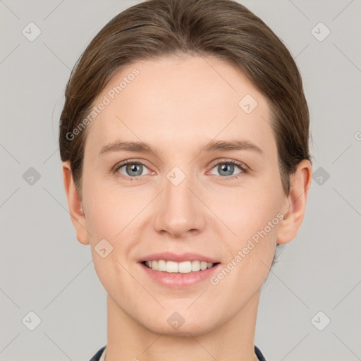 Joyful white young-adult female with short  brown hair and grey eyes