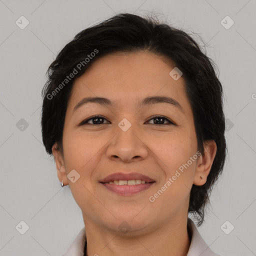 Joyful asian adult female with medium  brown hair and brown eyes