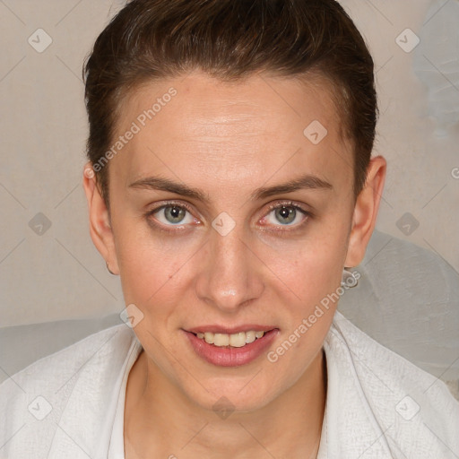 Joyful white young-adult female with short  brown hair and grey eyes