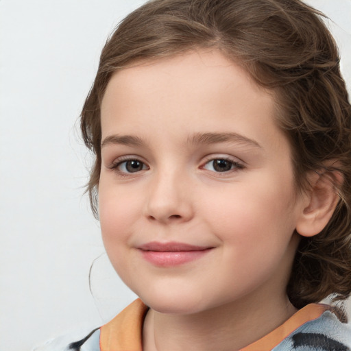 Joyful white child female with medium  brown hair and brown eyes