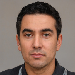 Neutral white young-adult male with short  black hair and brown eyes