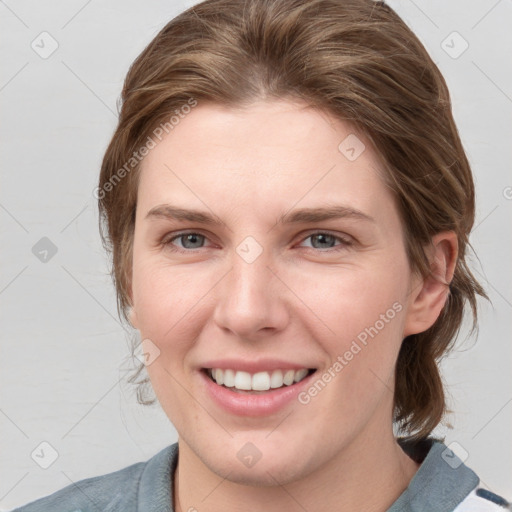 Joyful white young-adult female with medium  brown hair and blue eyes