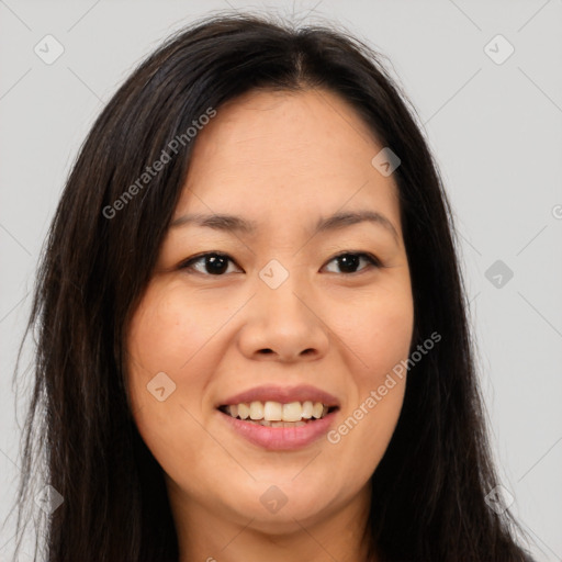 Joyful asian young-adult female with long  brown hair and brown eyes