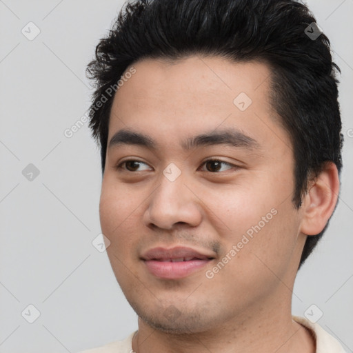 Joyful asian young-adult male with short  black hair and brown eyes