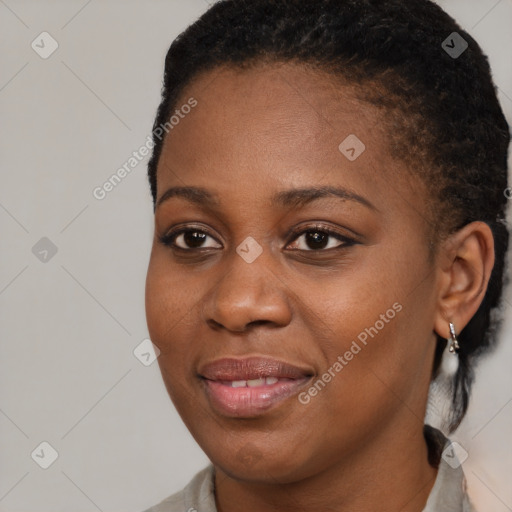 Joyful black young-adult female with short  brown hair and brown eyes