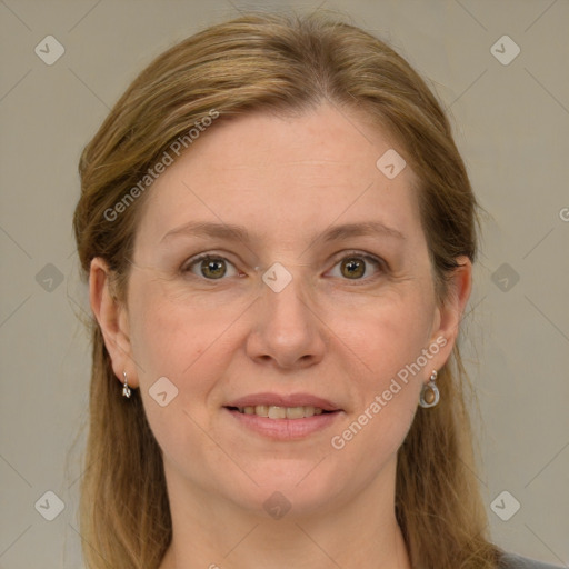 Joyful white adult female with medium  brown hair and grey eyes