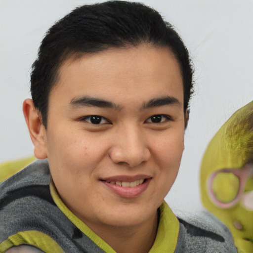 Joyful latino young-adult male with short  brown hair and brown eyes
