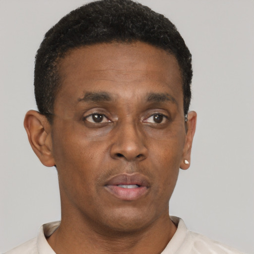 Neutral black young-adult male with short  brown hair and brown eyes