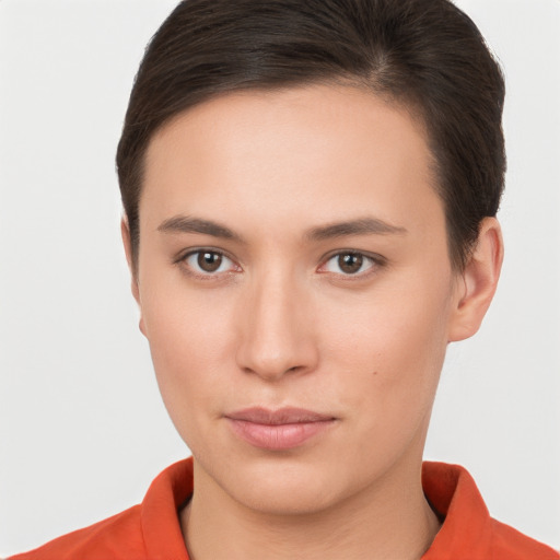 Neutral white young-adult female with short  brown hair and brown eyes