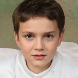 Joyful white child male with short  brown hair and brown eyes