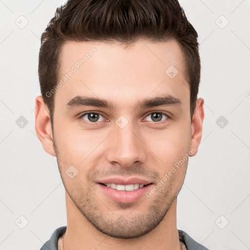 Joyful white young-adult male with short  brown hair and brown eyes