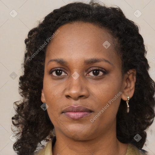 Neutral black young-adult female with long  brown hair and brown eyes