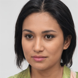 Joyful asian young-adult female with medium  brown hair and brown eyes