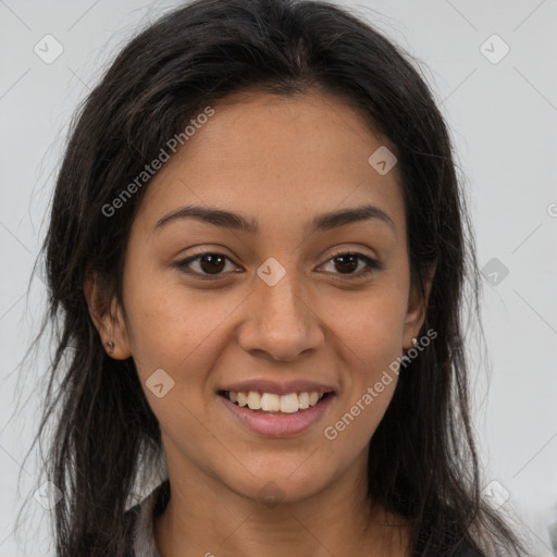 Joyful latino young-adult female with long  brown hair and brown eyes