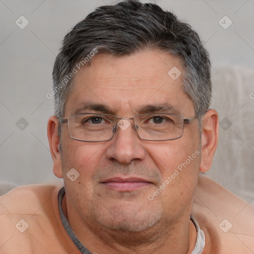 Neutral white middle-aged male with short  gray hair and brown eyes