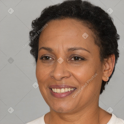 Joyful black adult female with short  brown hair and brown eyes