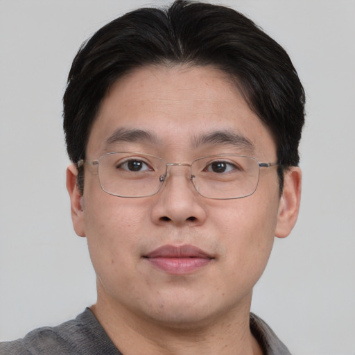 Neutral asian adult male with short  brown hair and brown eyes