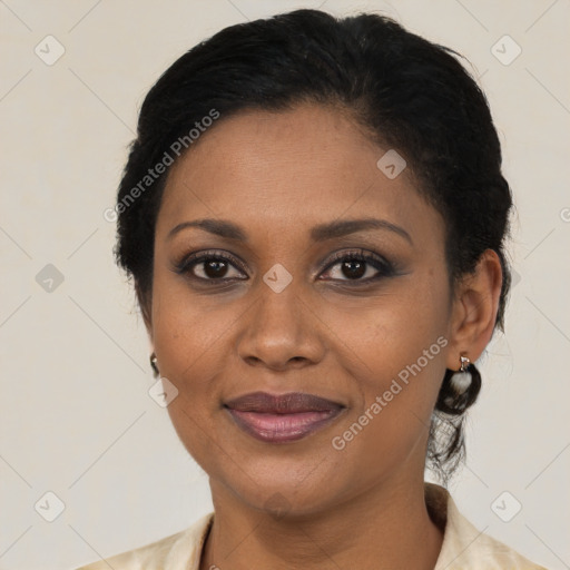 Joyful black adult female with medium  brown hair and brown eyes