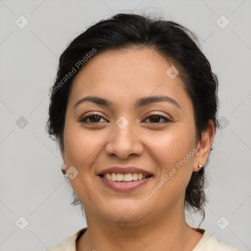 Joyful latino young-adult female with medium  brown hair and brown eyes