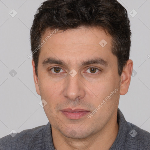 Joyful white adult male with short  brown hair and brown eyes