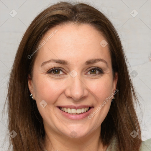 Joyful white adult female with long  brown hair and brown eyes