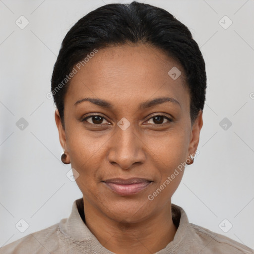 Joyful black young-adult female with short  black hair and brown eyes