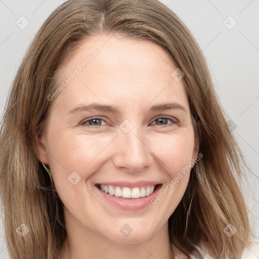 Joyful white young-adult female with long  brown hair and grey eyes