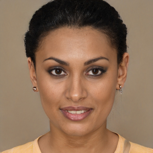 Joyful latino young-adult female with short  brown hair and brown eyes