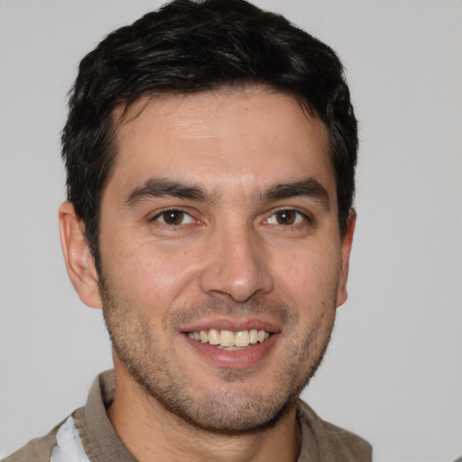 Joyful white young-adult male with short  brown hair and brown eyes